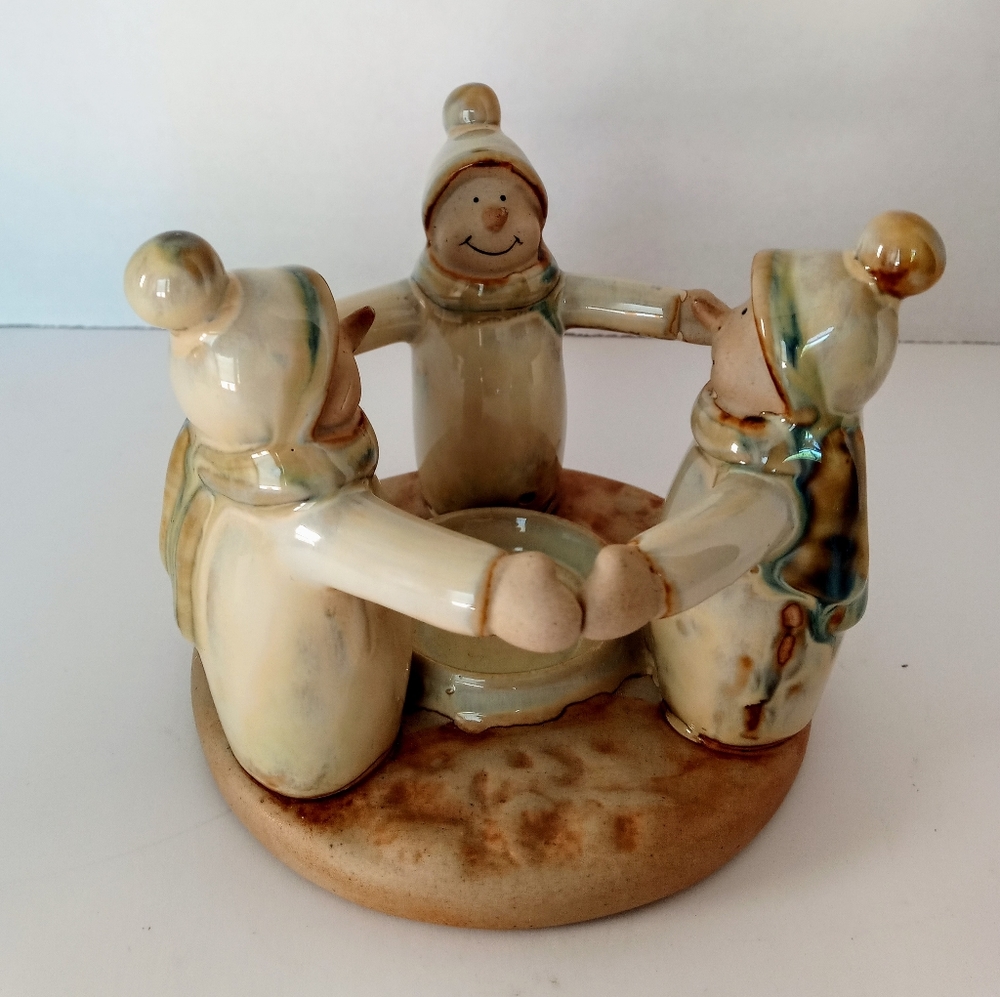 A ring if 3 snowmen tea light candle holder